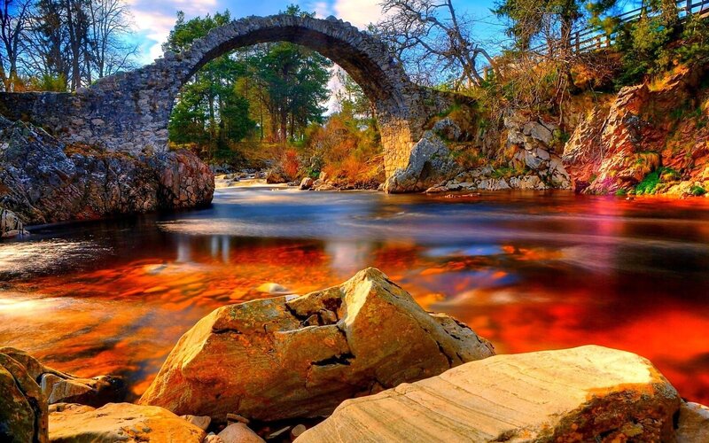 Stone Arch Bridge over River — Blue
