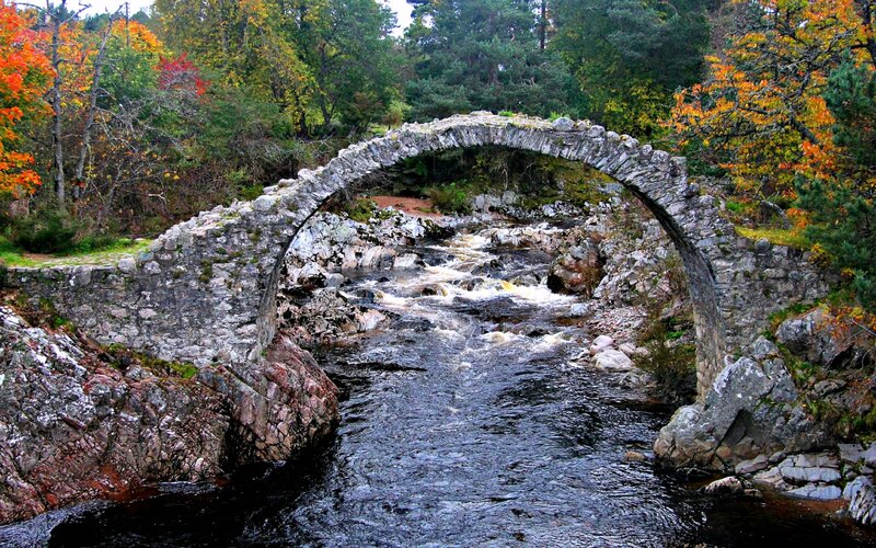 Stone Arch Bridge over River — Green, Serene