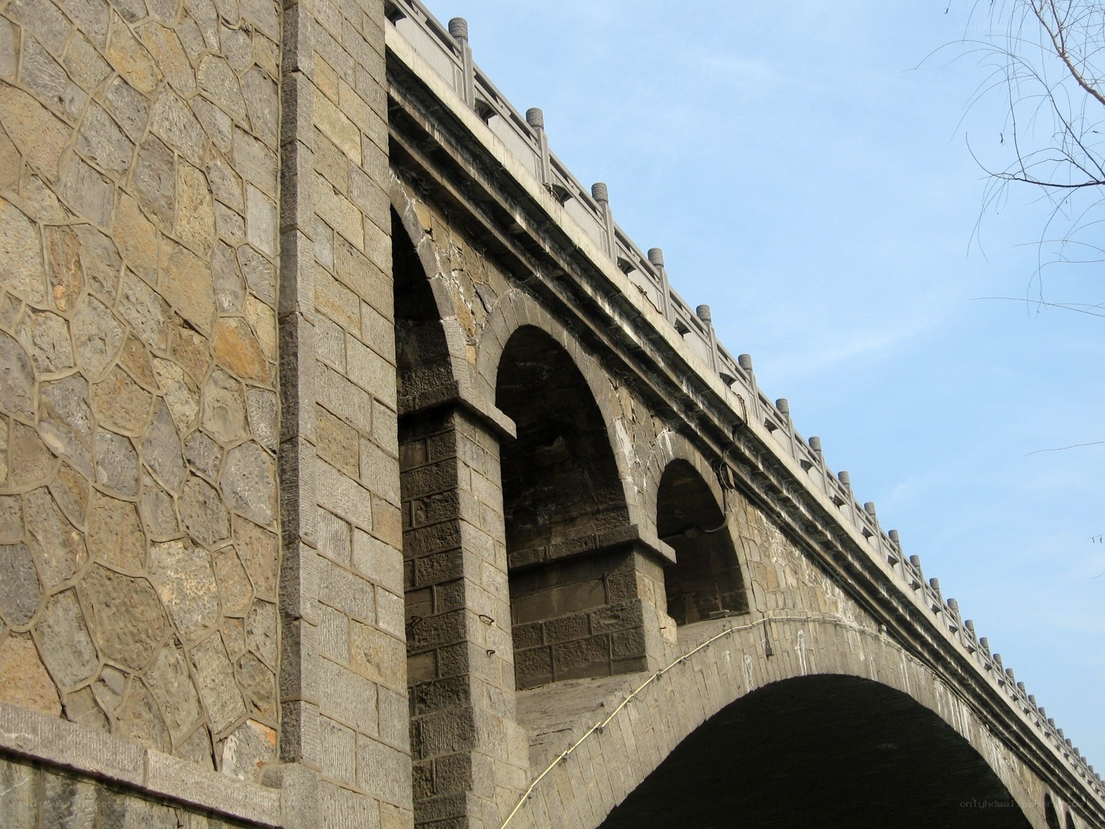 Stone arch bridge under blue sky