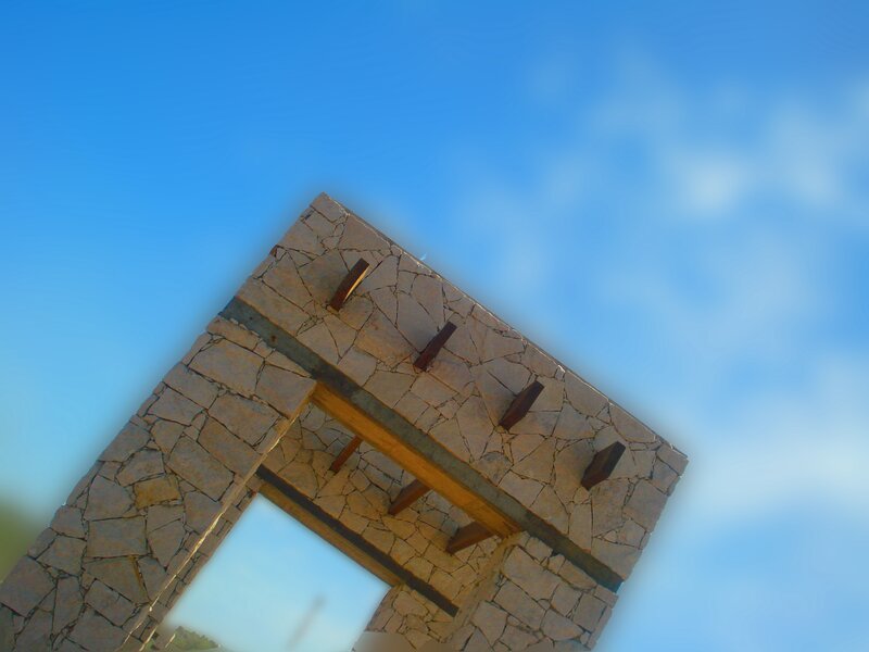 stone archway against blue sky