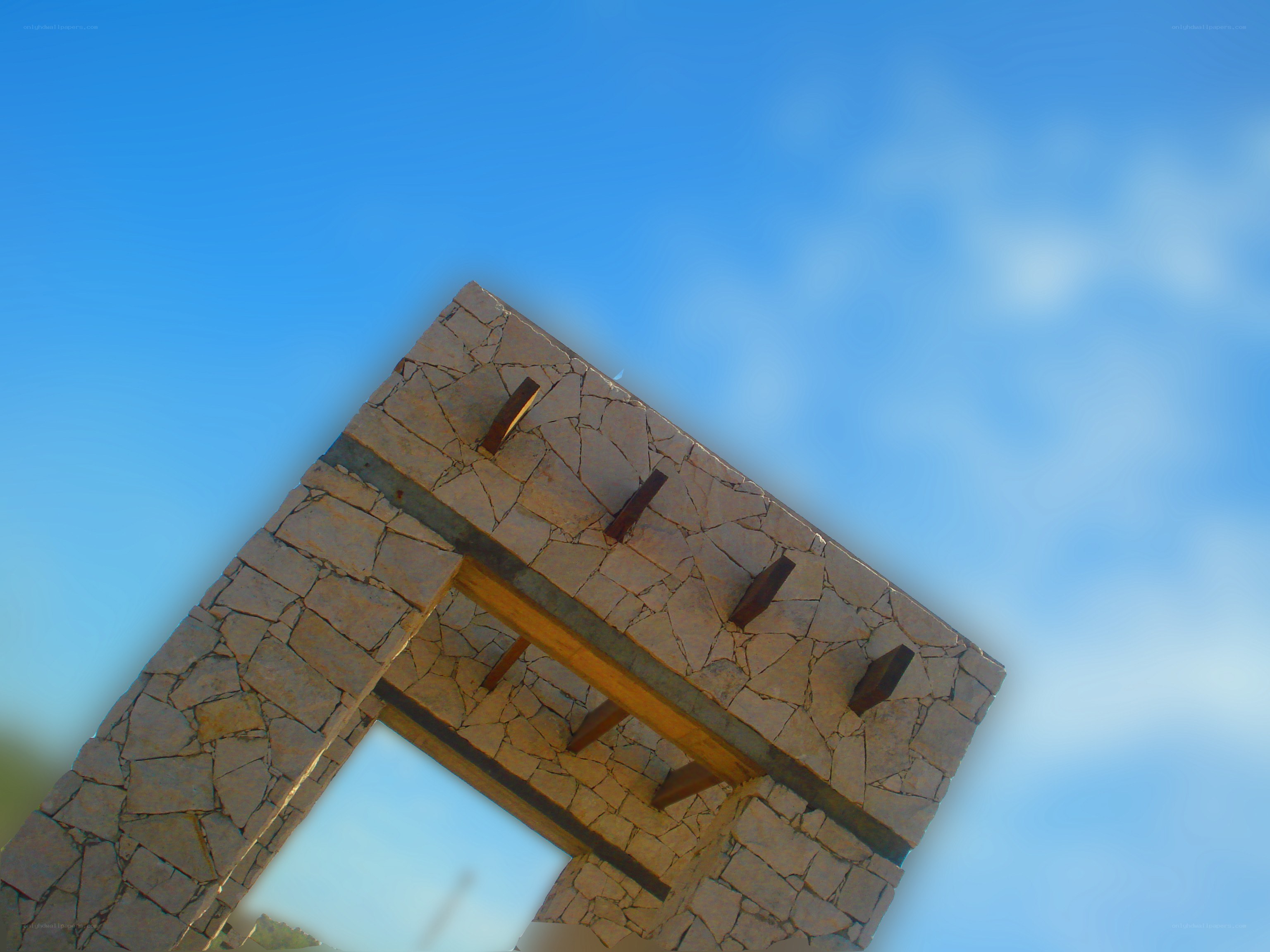 stone archway against blue sky