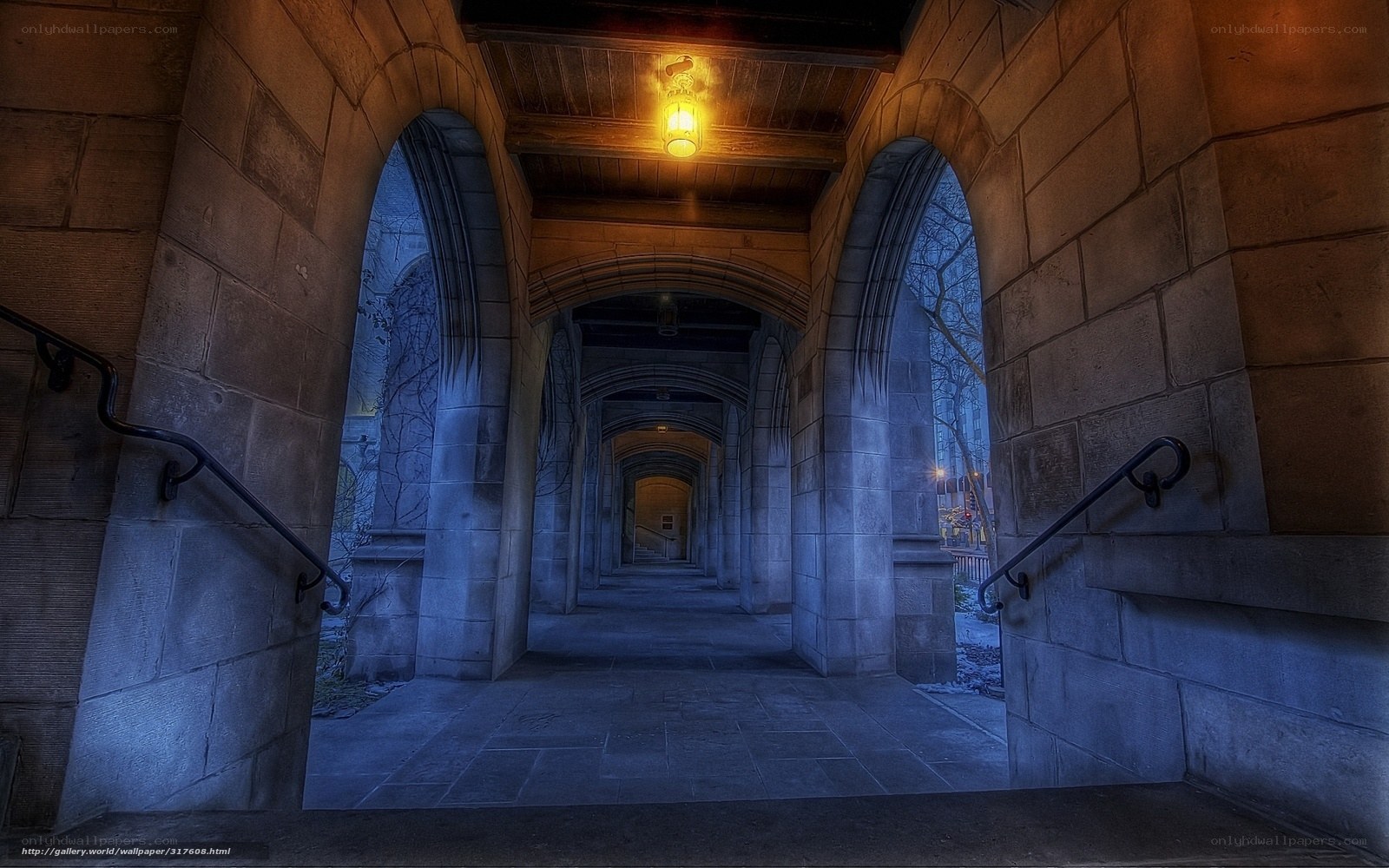 Stone archway corridor at dusk