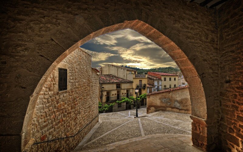 Stone archway view of old town