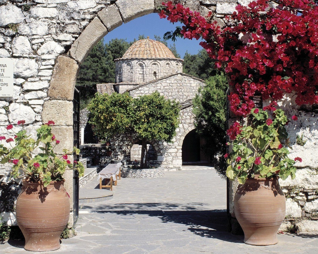 Stone archway with church view