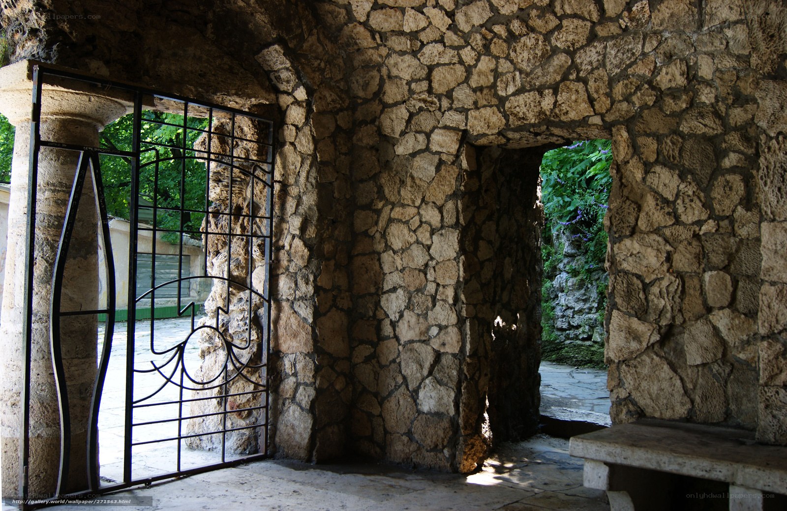 Stone archway with iron gate