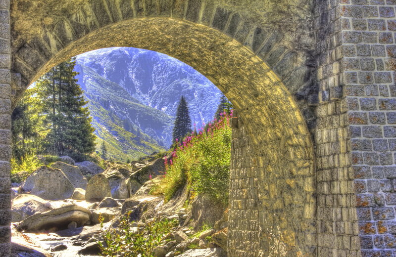 Stone archway with mountain view