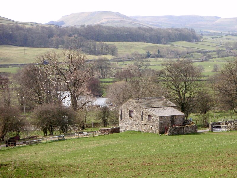 Stone barn in rural valley