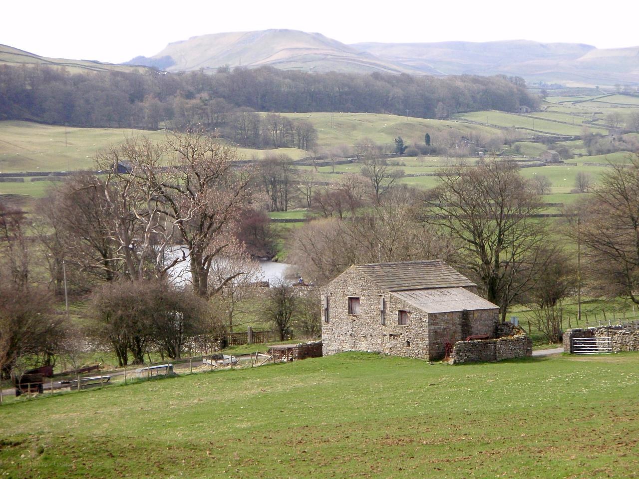 Stone barn in rural valley