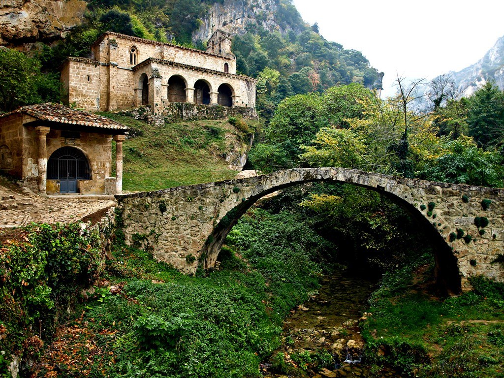 Stone bridge and chapel in a valley