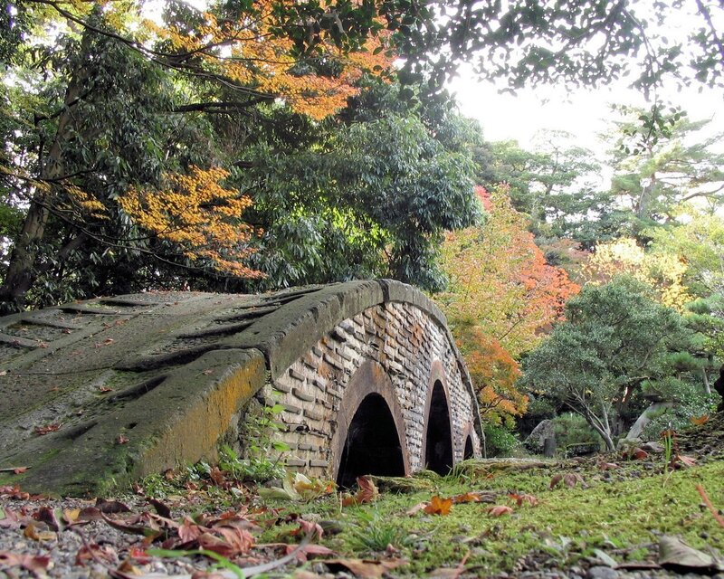 Stone bridge in autumn garden