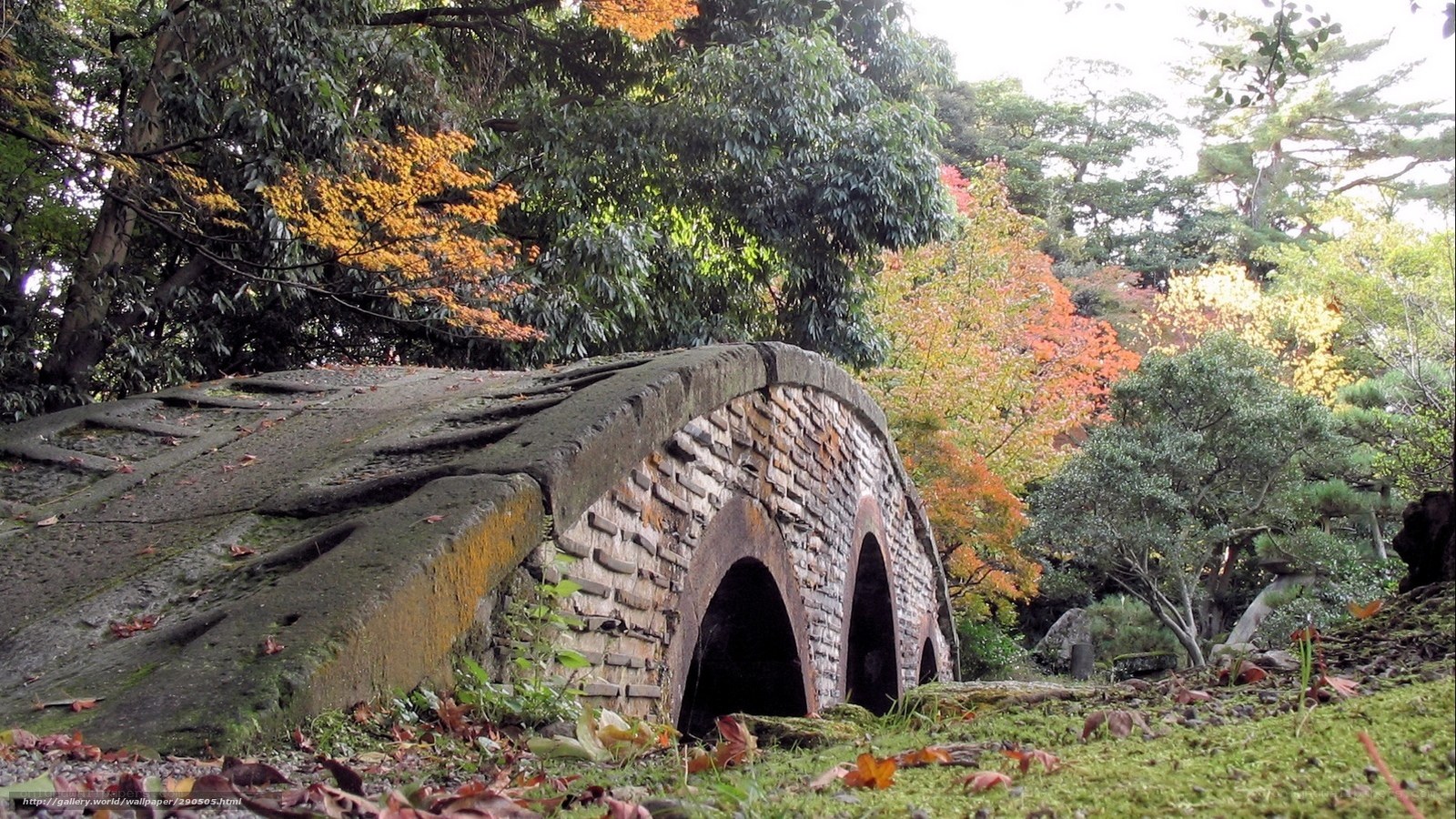 Stone bridge in autumn garden