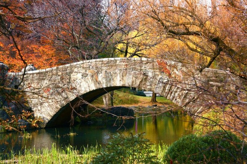Stone bridge in autumn park