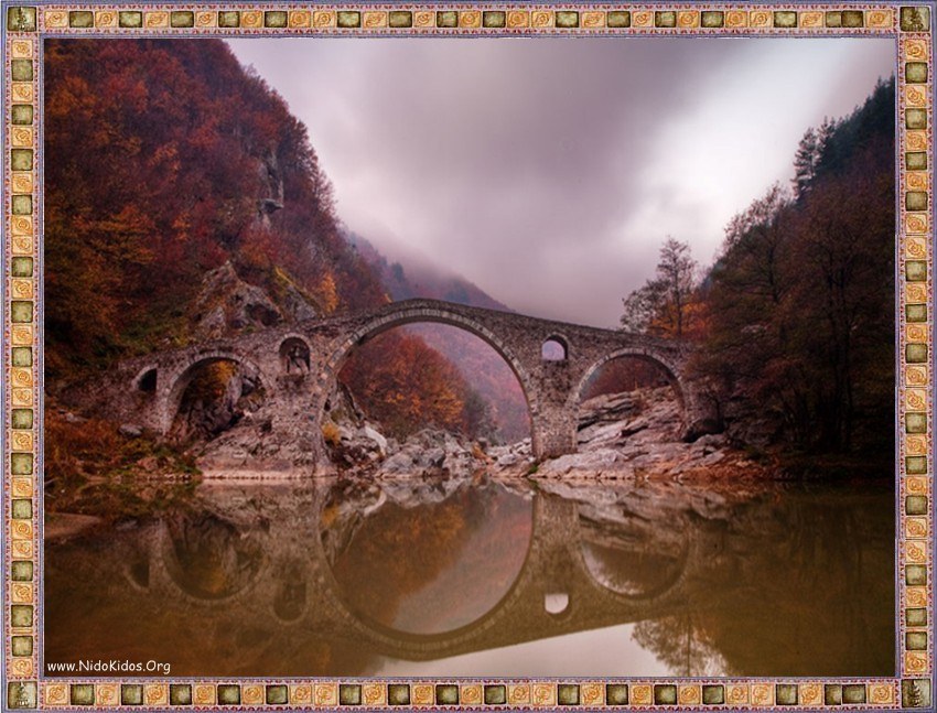 Stone bridge in autumn valley