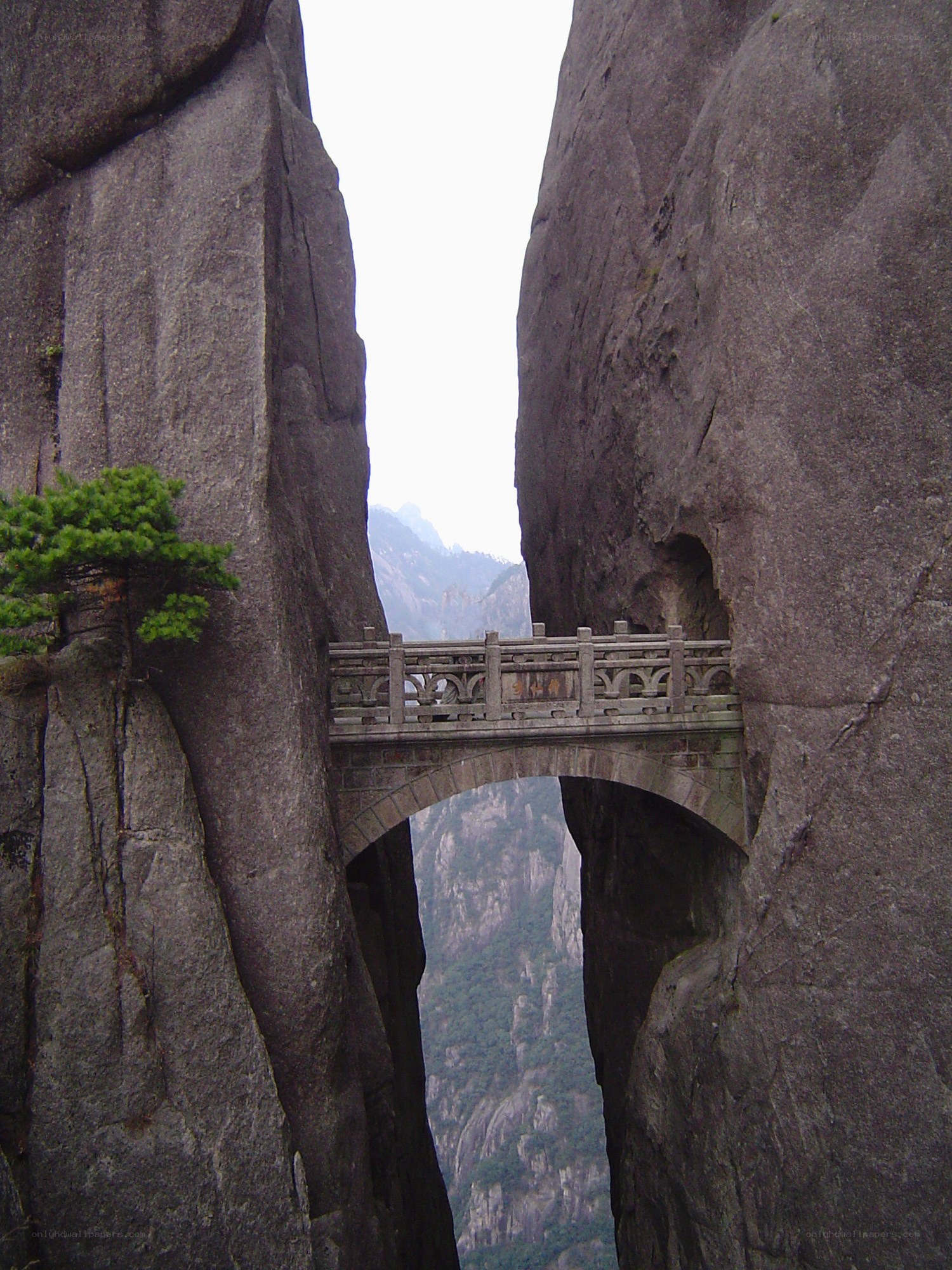 Stone bridge in mountain gorge