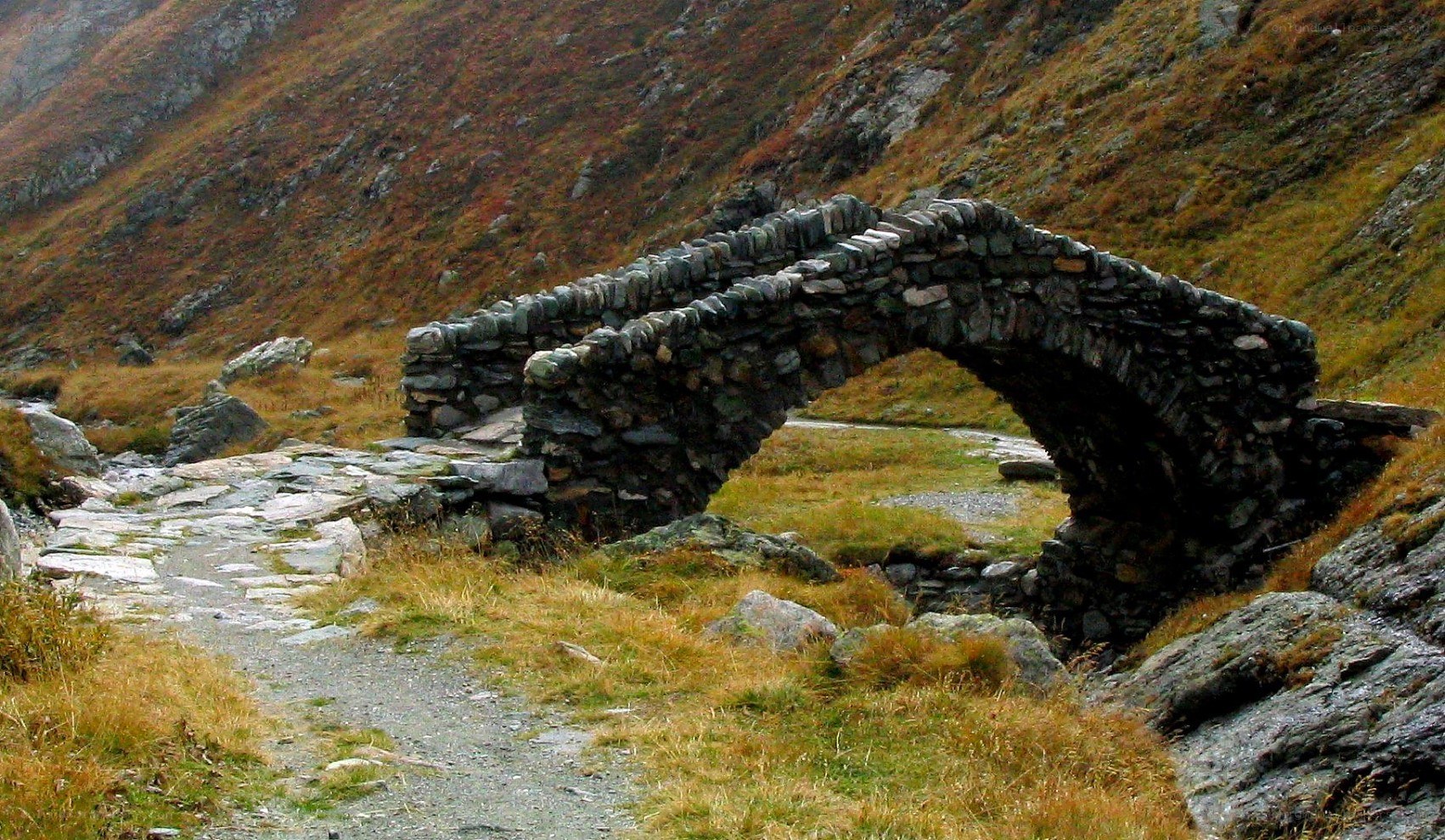 Stone bridge in mountain valley