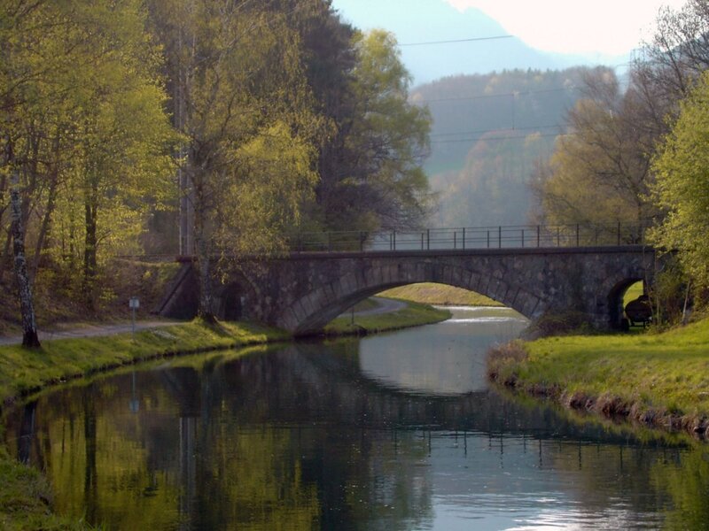 Stone bridge over a calm canal