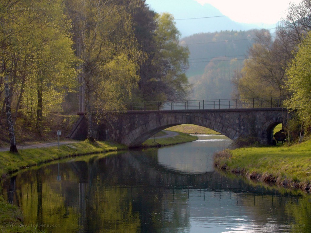 Stone bridge over a calm canal