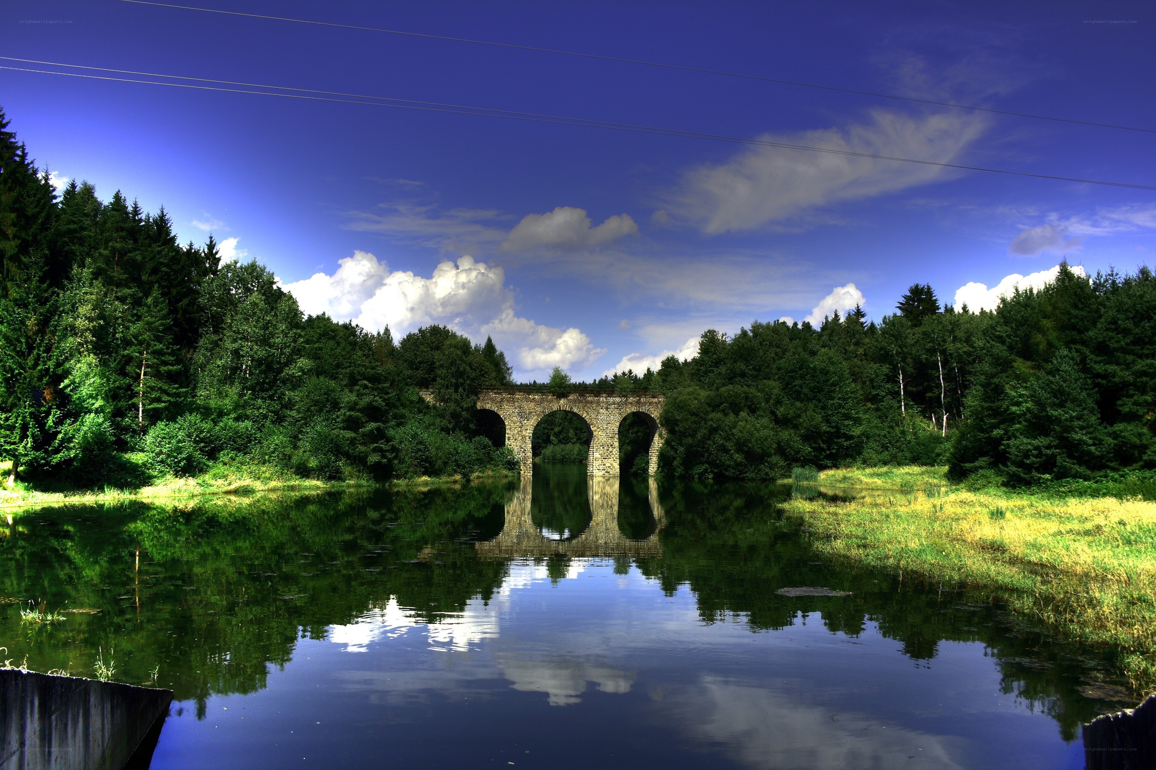 Stone bridge over a calm river