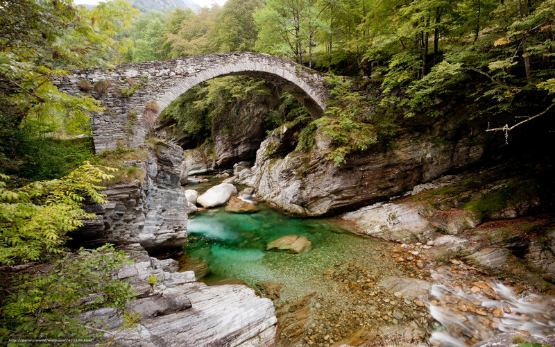 Stone bridge over a clear river