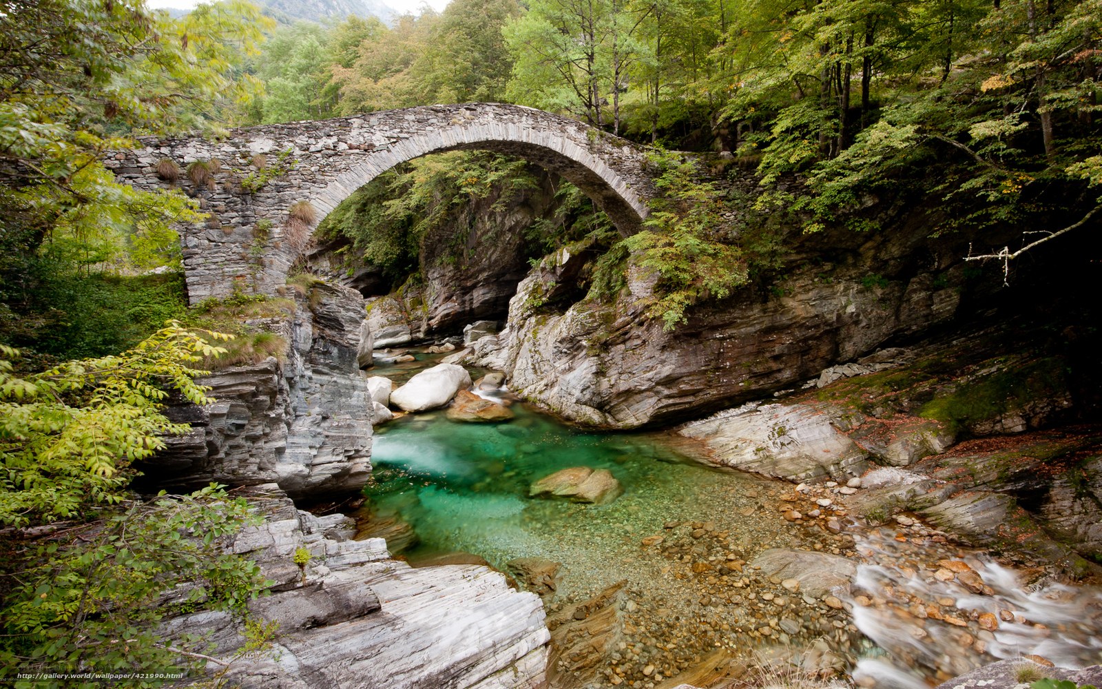 Stone bridge over a clear river