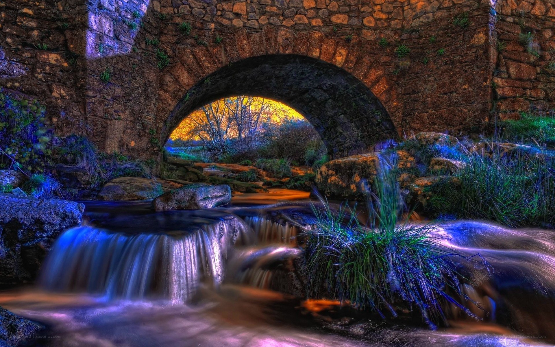 Stone bridge over a flowing stream
