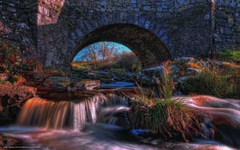 Stone bridge over a flowing stream