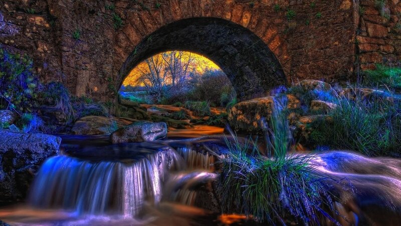 Stone bridge over a waterfall
