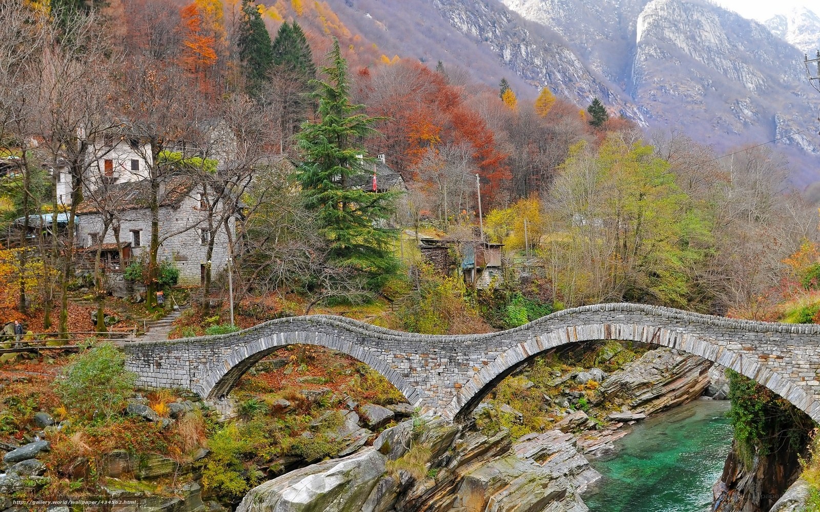 Stone bridge over autumn river