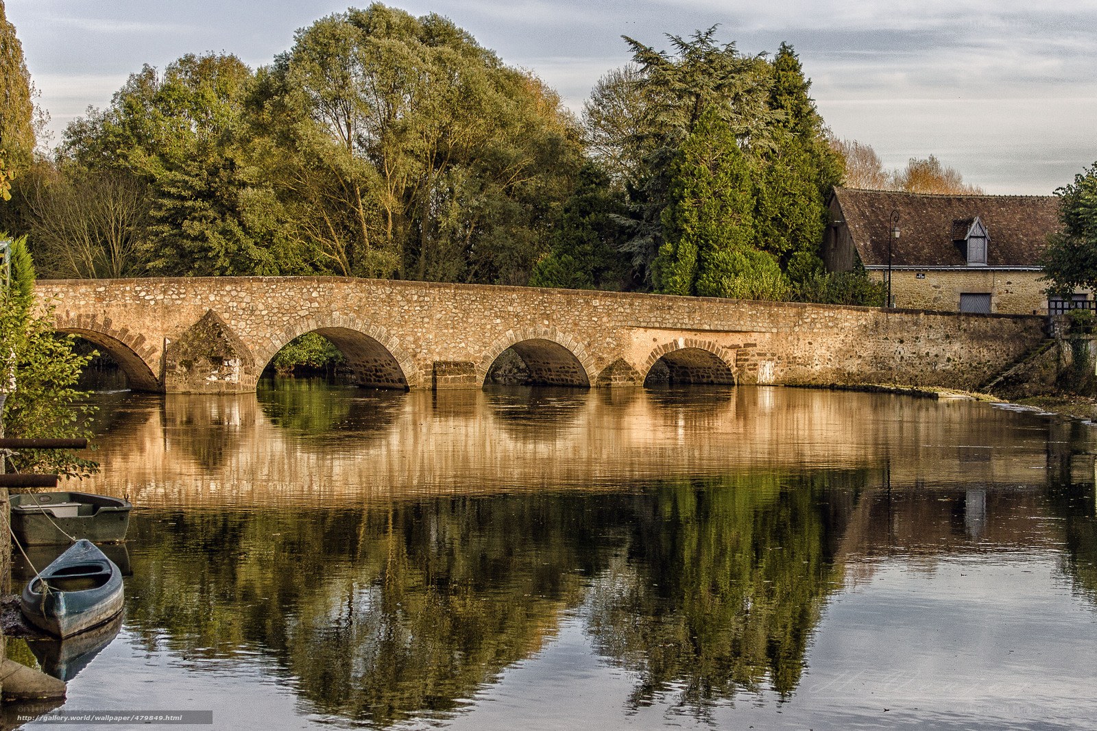 Stone bridge over calm river