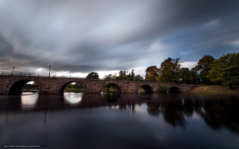 Stone bridge over calm river