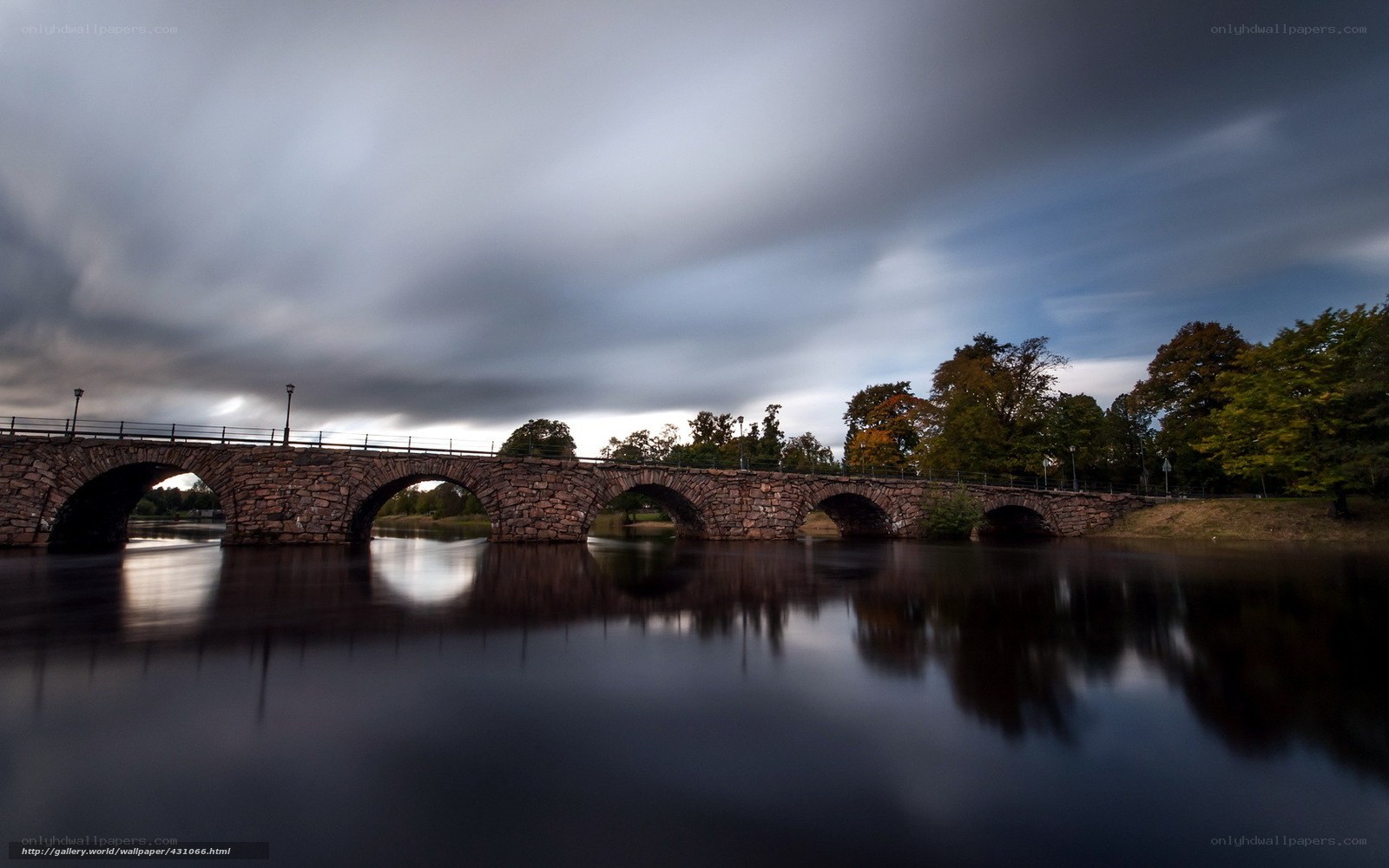 Stone bridge over calm river