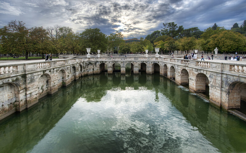 Stone Bridge over Canal — Green, Serene, Afternoon