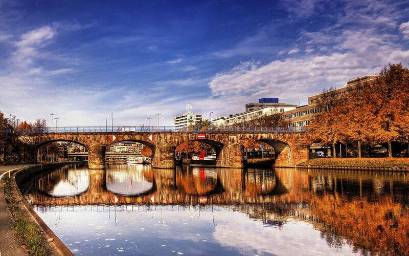 Stone bridge over canal in autumn