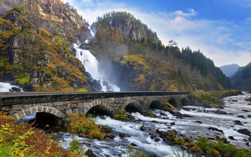 Stone Bridge over River — Blue, Dramatic, Afternoon, Photograph, Waterfall