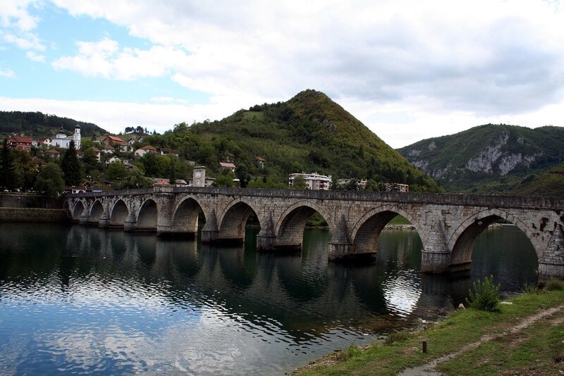 Stone Bridge over River — Blue, Serene, Afternoon, Photograph, Hills, Town