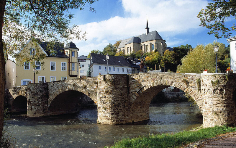 Stone Bridge over River — Blue, Serene, Autumn, Photograph, Church