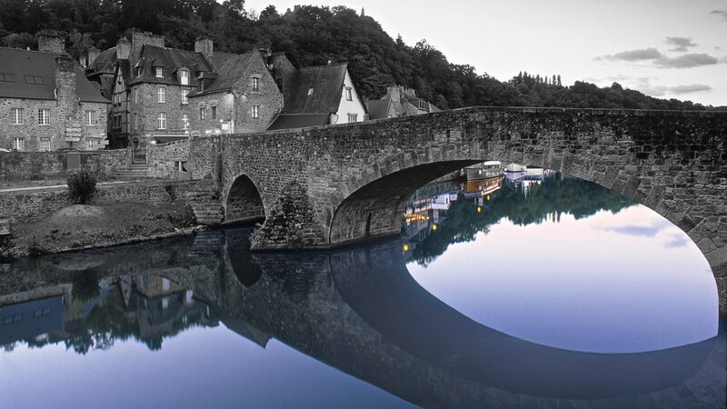 Stone Bridge over River — Blue, Serene, Sunset, Photograph, Buildings, Boats