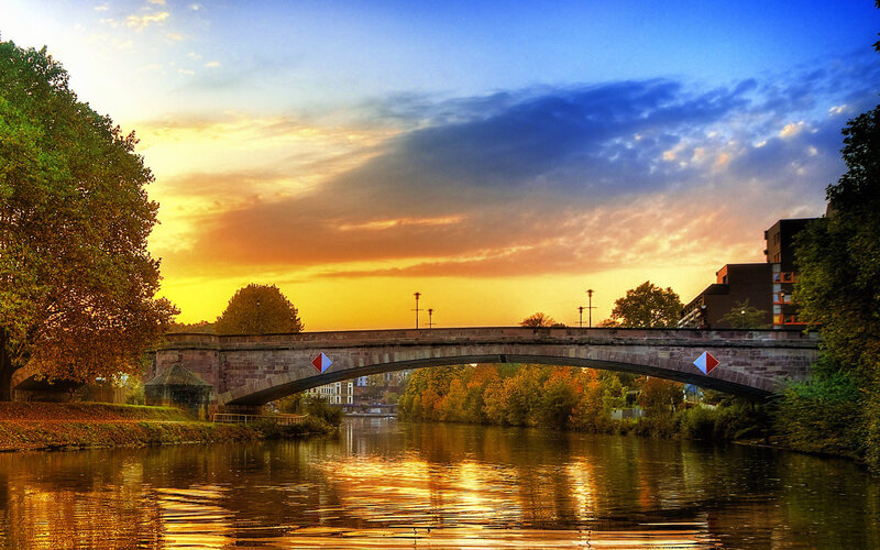 Stone Bridge over River — Blue, Serene, Sunset, Photograph, Trees, Sky