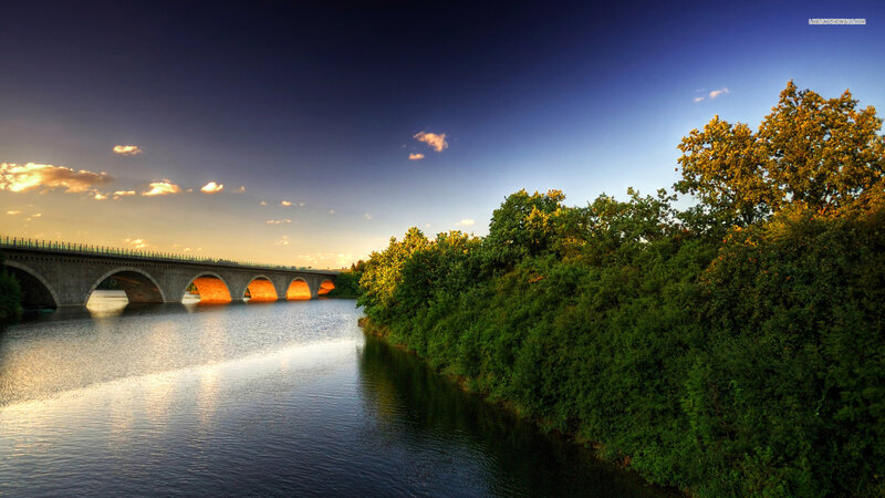 Stone Bridge over River — Blue, Serene, Sunset, Photograph, Trees