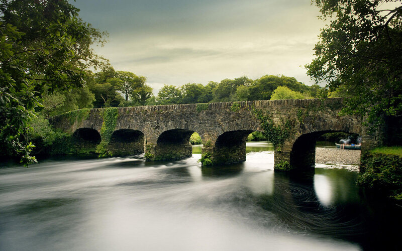 Stone Bridge over River — Boat