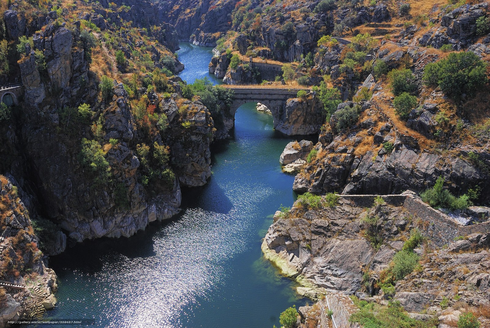 Stone bridge over river canyon