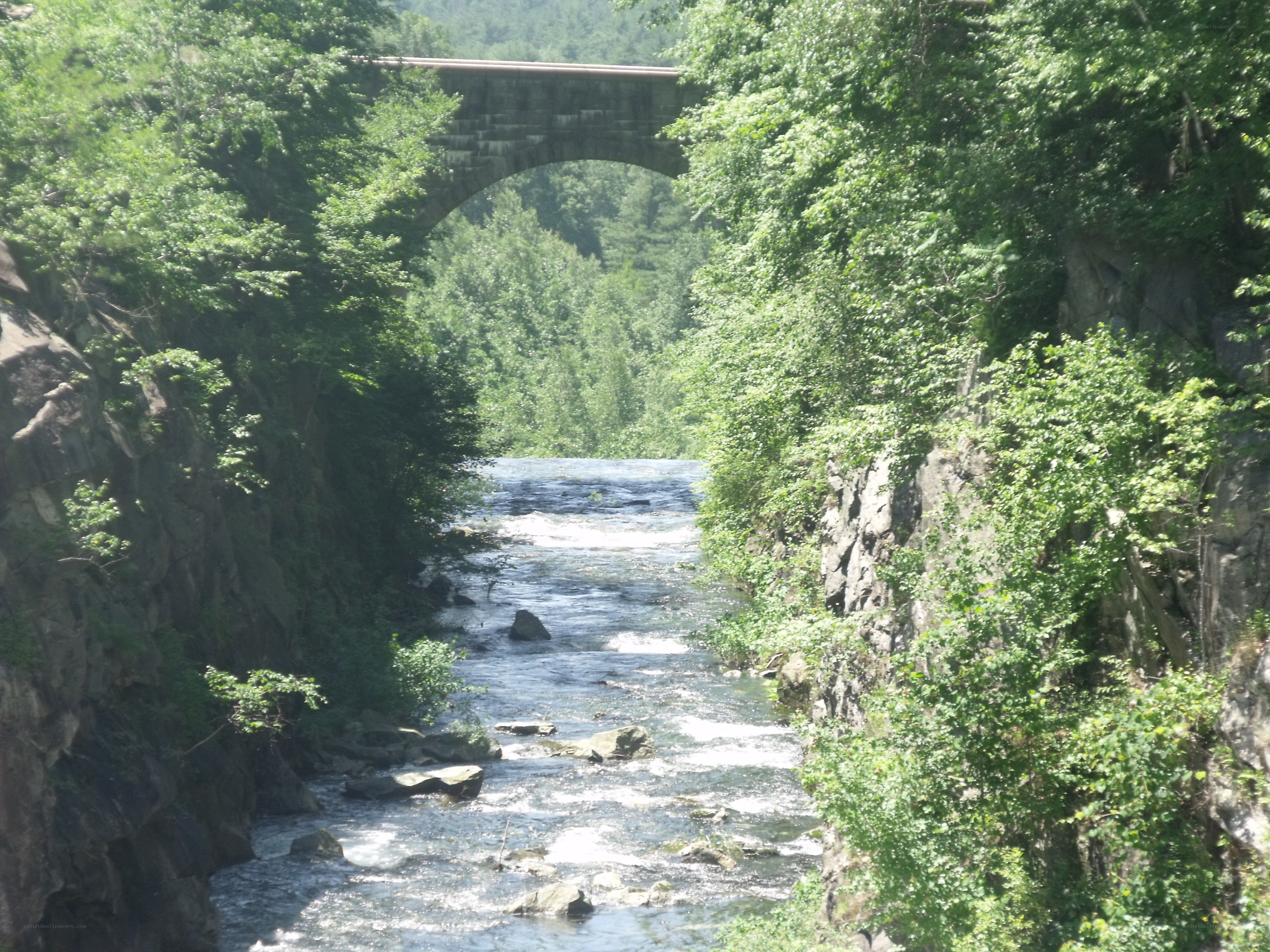 Stone bridge over river gorge