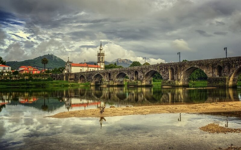 Stone Bridge over River — Gray, Dramatic, Afternoon, Photograph, Church
