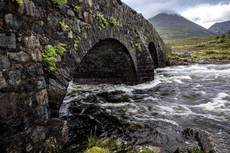 Stone Bridge over River — Gray, Dramatic, Afternoon, Photograph, Mountain
