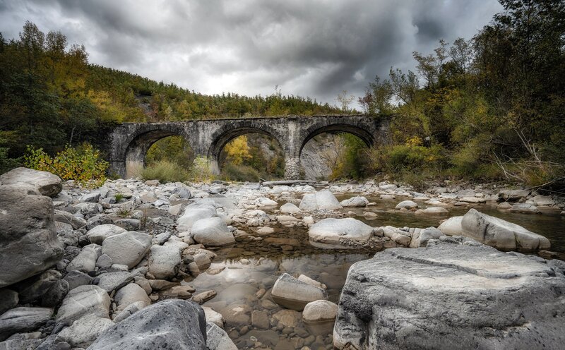 Stone Bridge over River — Gray, Dramatic, Autumn, Photograph, Rocks