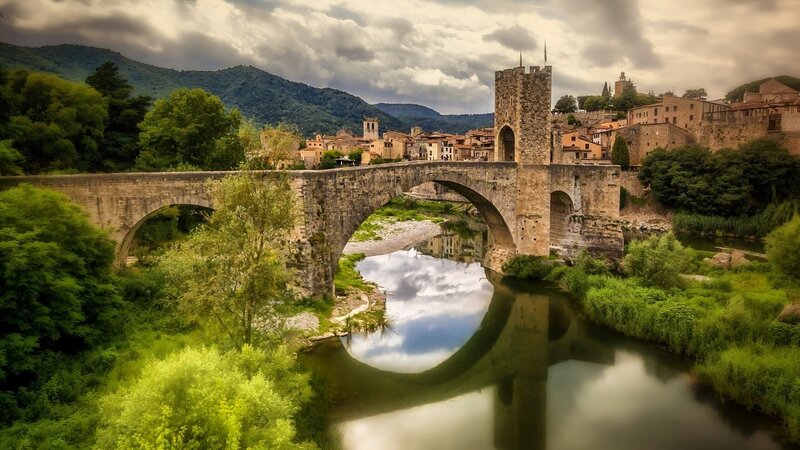 Stone Bridge over River — Green, Dramatic, Afternoon, Photograph, Town, Mountains