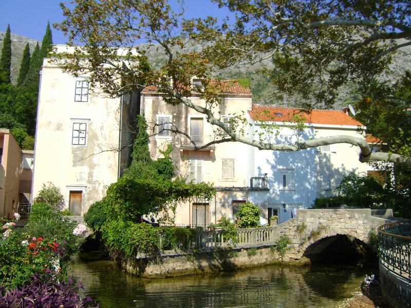 Stone Bridge over River — Green, Serene, Afternoon, Photograph, Buildings
