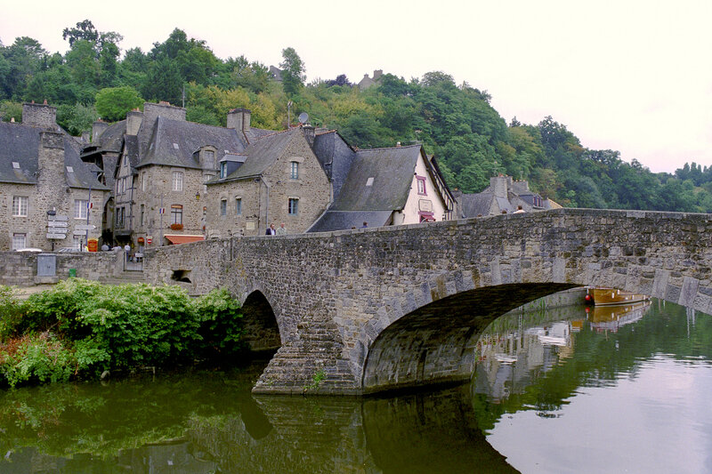 Stone Bridge over River — Green, Serene, Afternoon, Photograph, Buildings, Trees, Boat