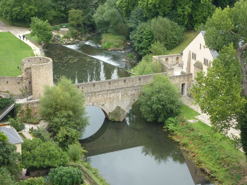 Stone Bridge over River — Green, Serene, Afternoon, Photograph, Castle Ruins