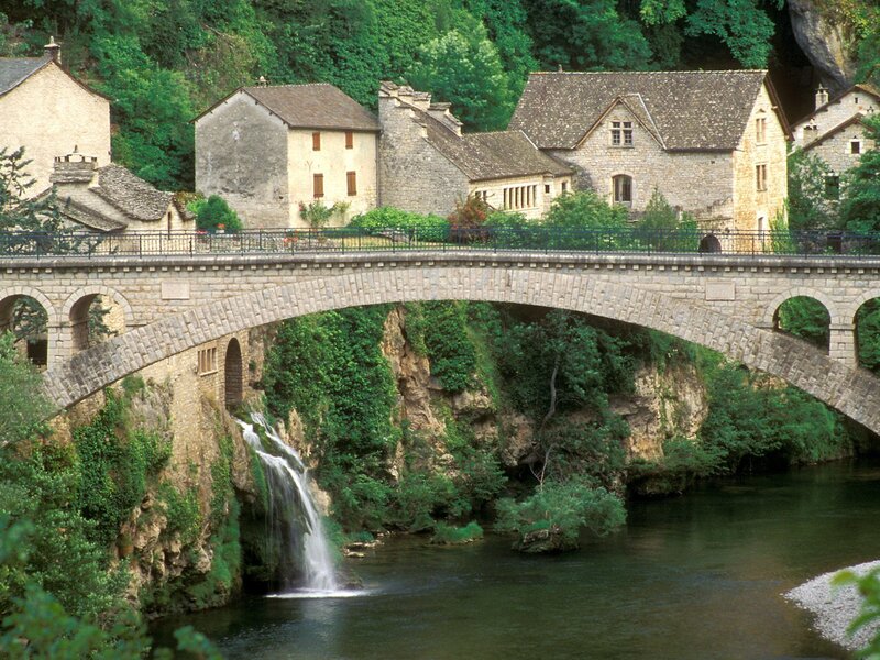 Stone Bridge over River — Green, Serene, Afternoon, Photograph, Houses, Trees